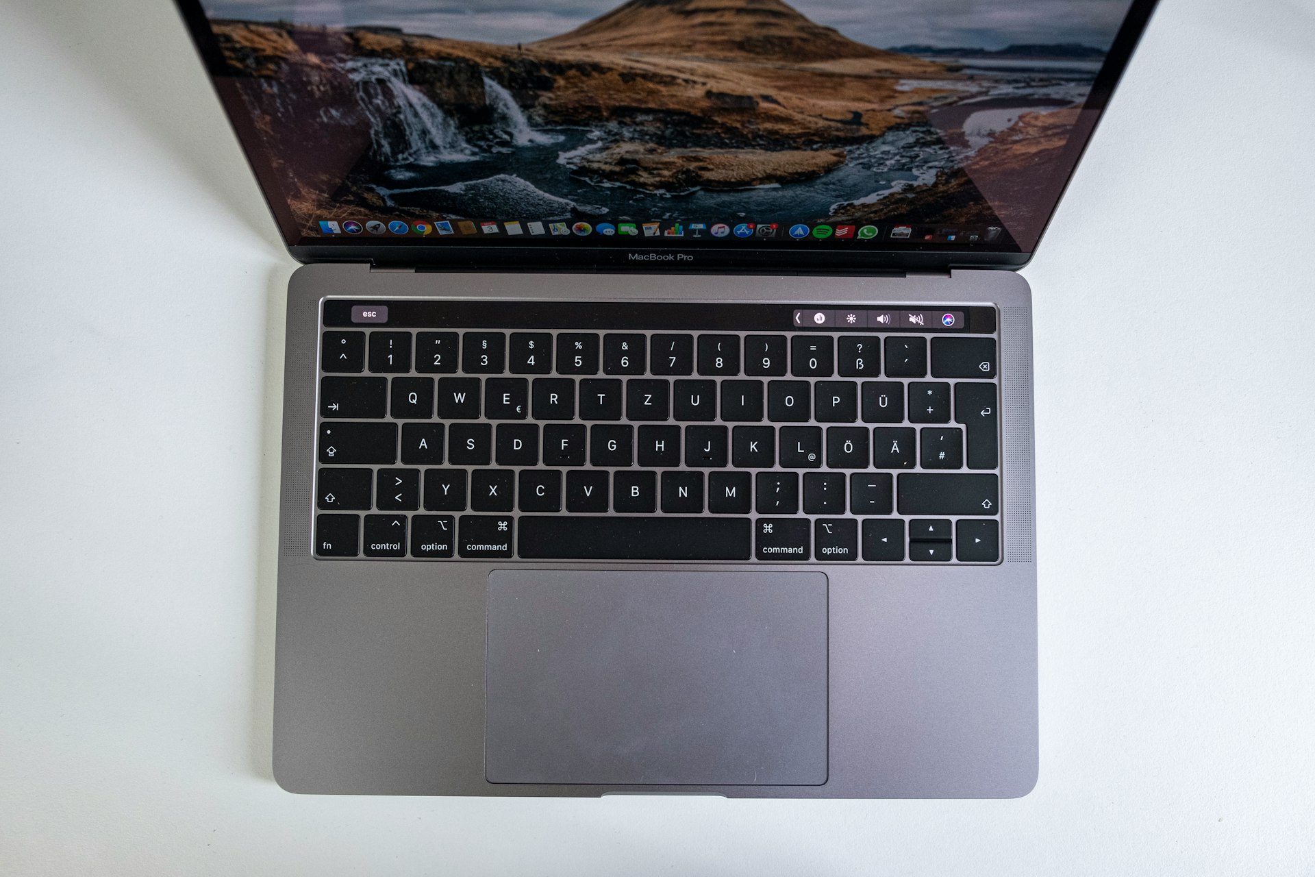 macbook pro on white table